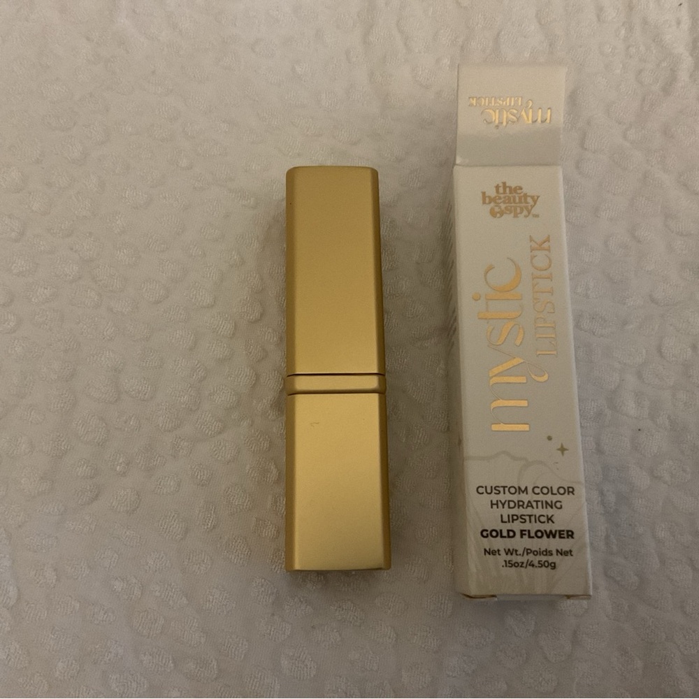 NEW - The Beauty Spy Mystic Flower Lipstick Gold Flower Edition. 0.15 oz